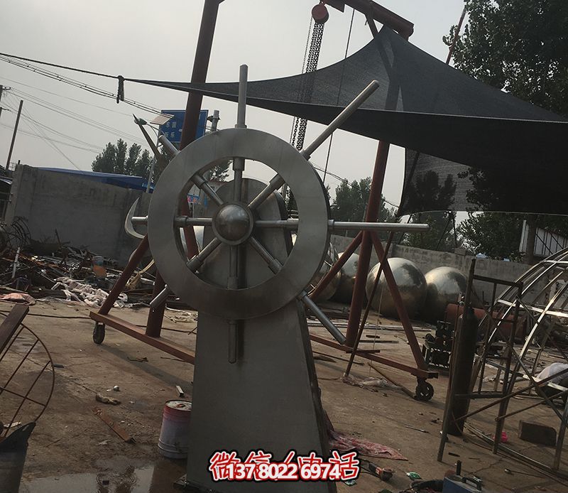 騰飛不銹鋼雕塑船舵，點綴室內(nèi)飯店